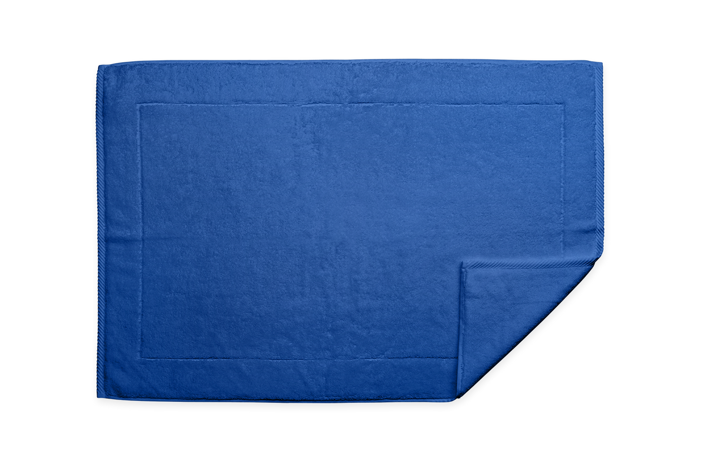 Corner detail of Matouk Milagro tub mat in cobalt blue terry cotton.