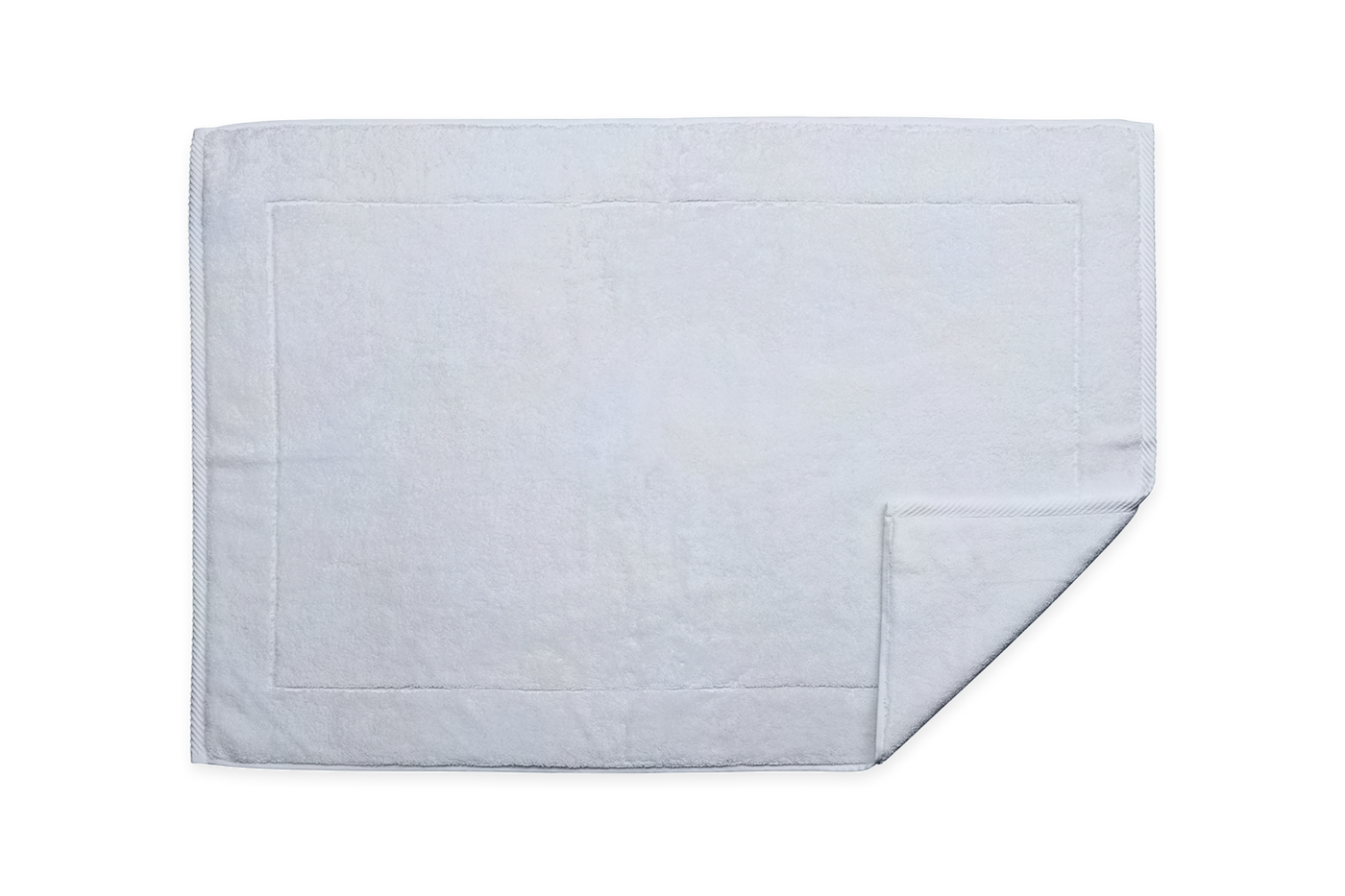 Flat lay of white terry tub mat with woven border detail, corner fold visible.