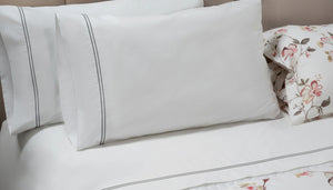 Photo of the Mimosa Embroidered Sheet Set ensemble.