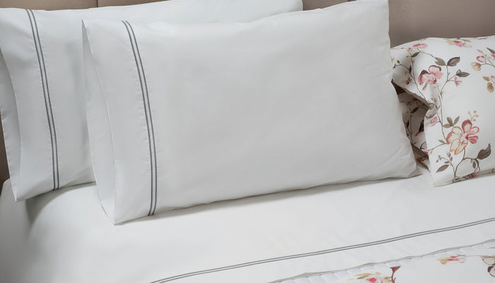 Photo of the Mimosa Embroidered Sheet Set ensemble.