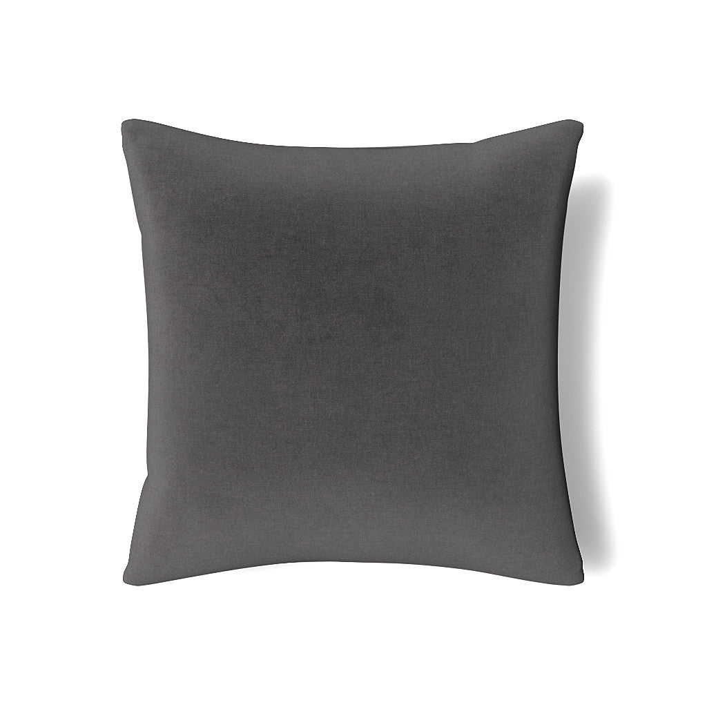 Ann Gish Modern velvet pillow in charcoal, flat lay on white background.