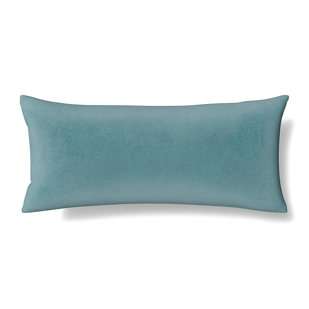 Ann Gish Modern Velvet lumbar pillow in teal, smooth velvet surface, rectangular bolster shape.