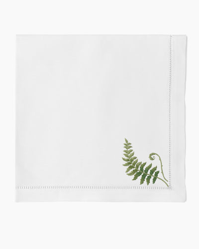 Henry Handwork Fern Fronds white linen dinner napkin with green embroidered fern and hemstitch border.