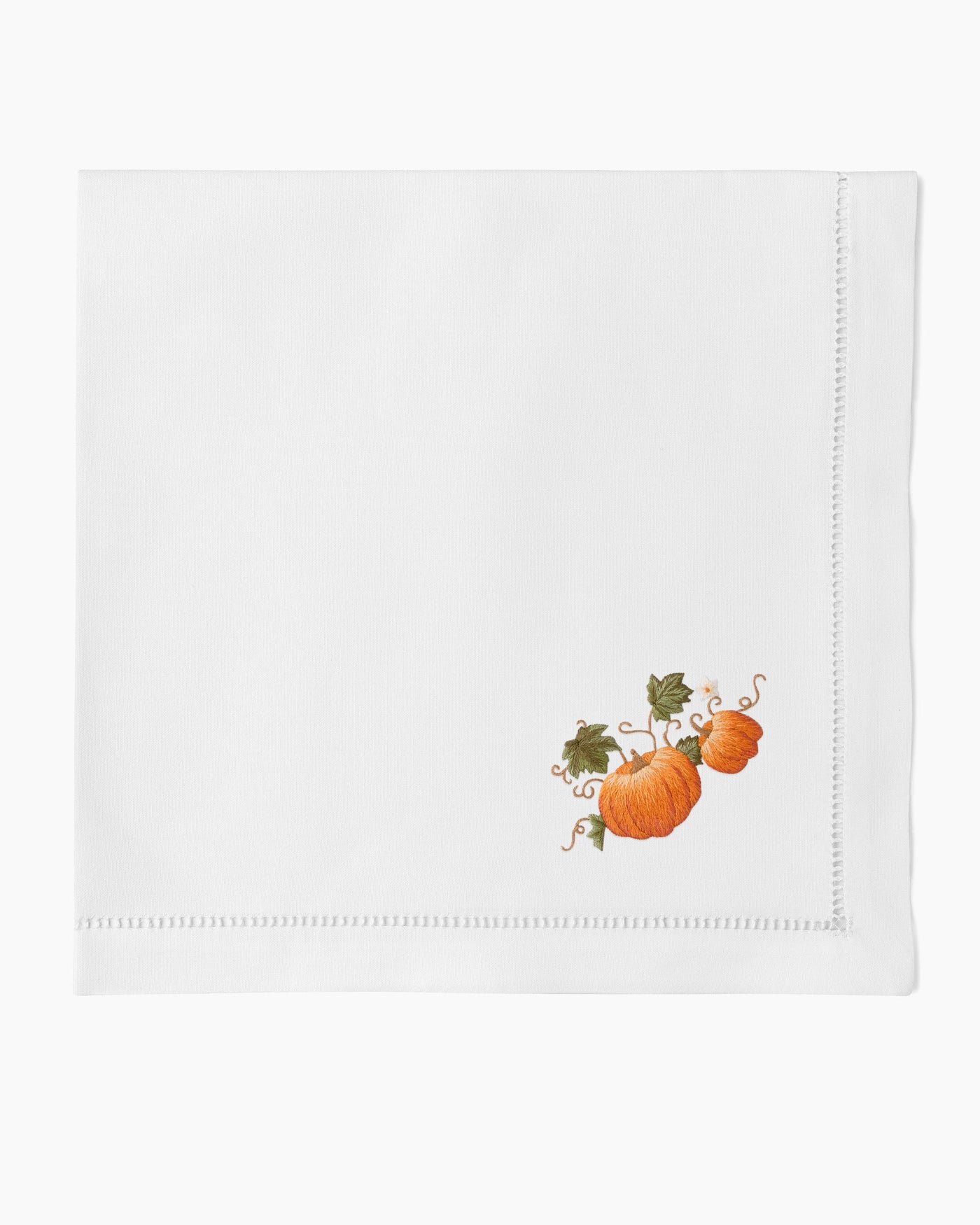 Henry Handwork Pumpkins Grande white linen dinner napkin with embroidered pumpkins.