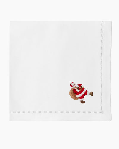 Henry Handwork white linen dinner napkin with embroidered Santa Claus motif and hemstitch border.