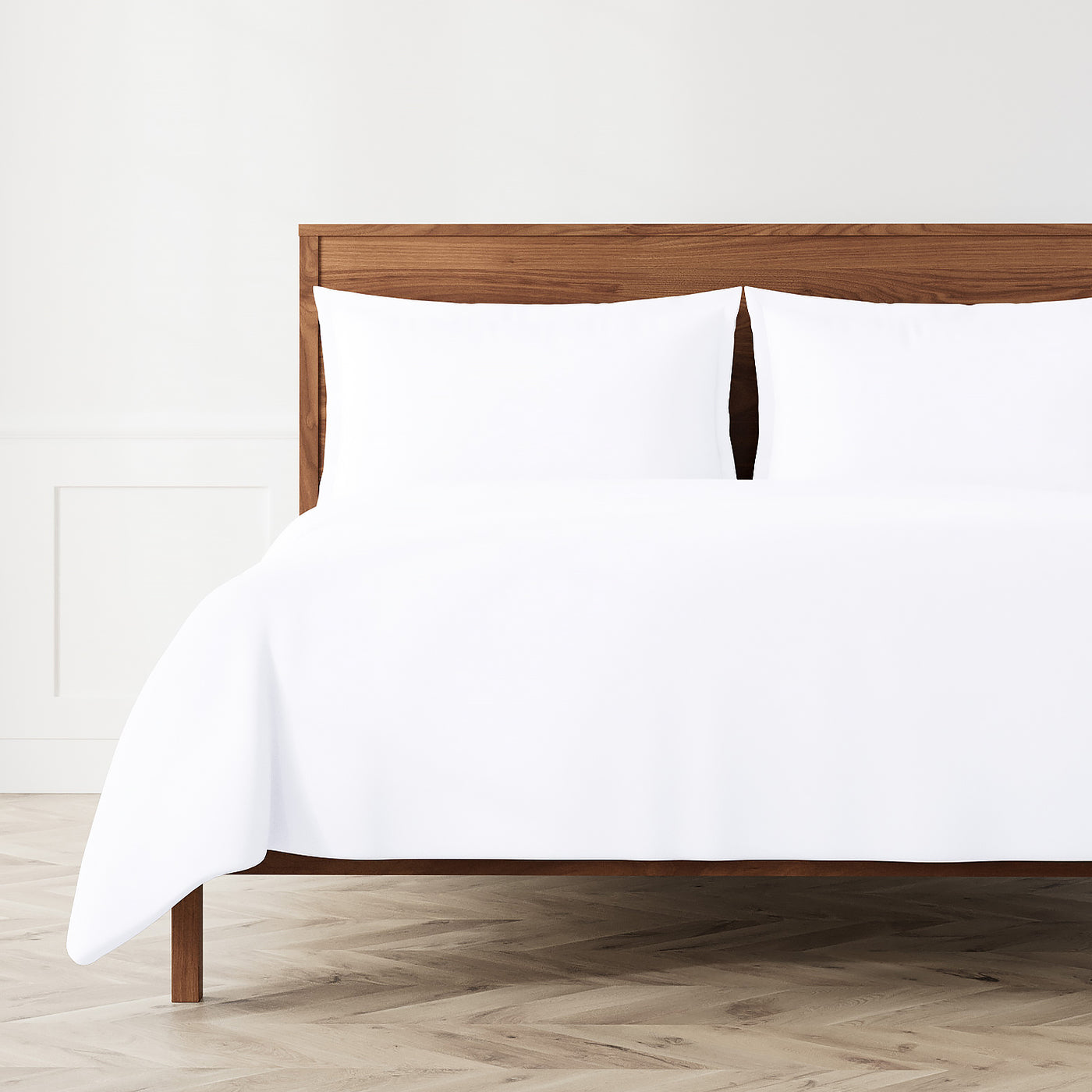 White Ann Gish Neo duvet set on walnut bed, full styled bedroom view.