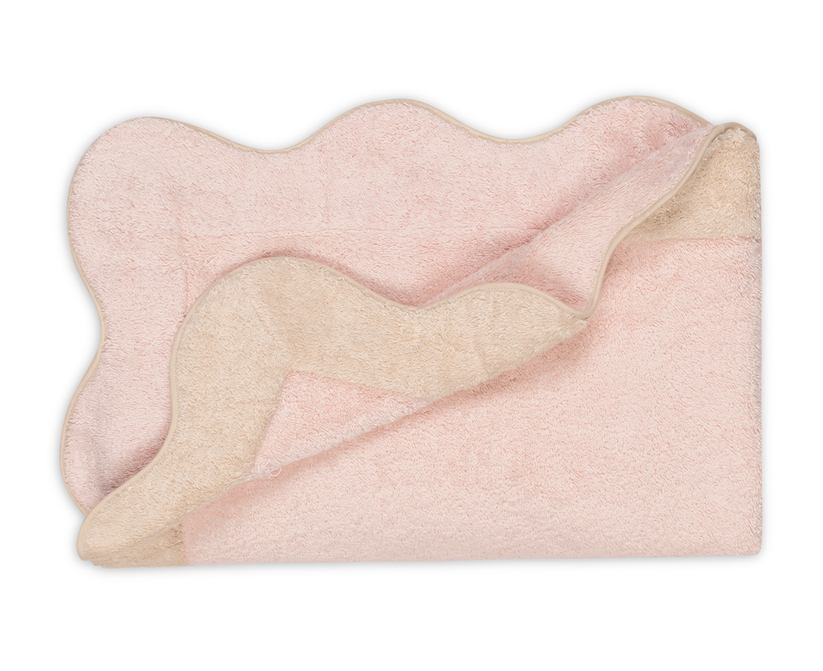The Matouk Neptune Pool Towel, in pale pink Cairo cotton with scalloped edges, is shown folded and rectangular on a white background.