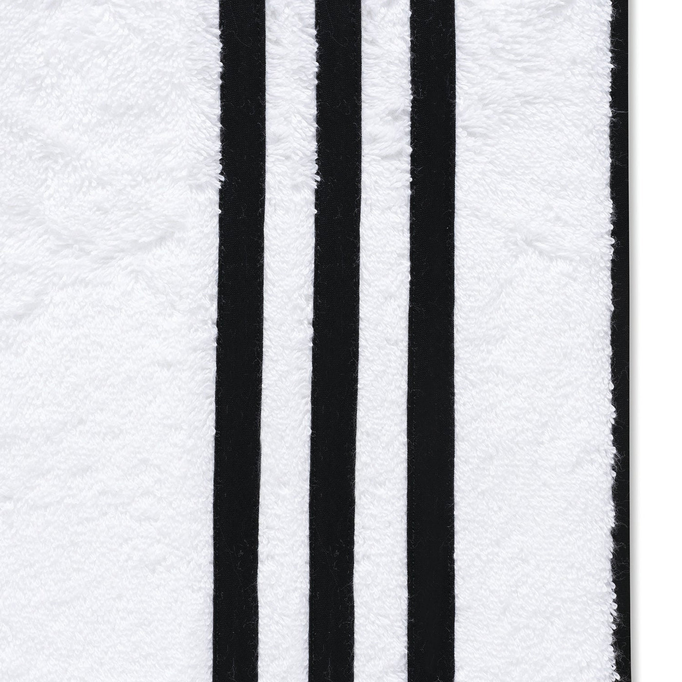 The Matouk Newport Shower Curtain features a white diamond piqué fabric surface with three parallel vertical black stripes.