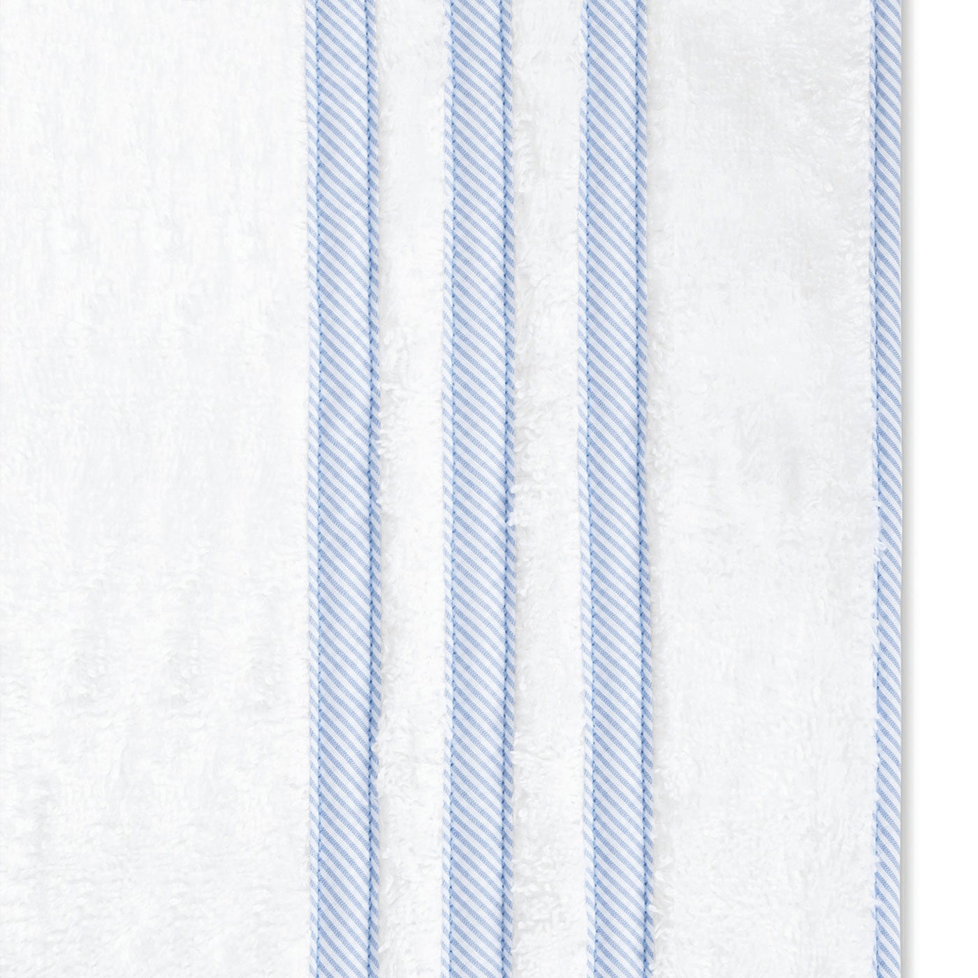 White towel featuring four vertical light blue stripes on the right, designed to pair beautifully with Matouk’s Newport Shower Curtain.
