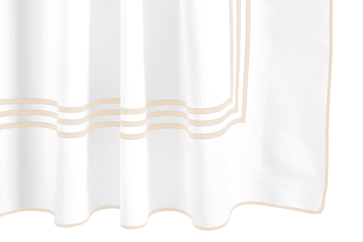 The Matouk Newport Shower Curtain features three parallel beige stripes and a matching rectangular border near the bottom, all on a subtle diamond pique texture for an elegant bath update.