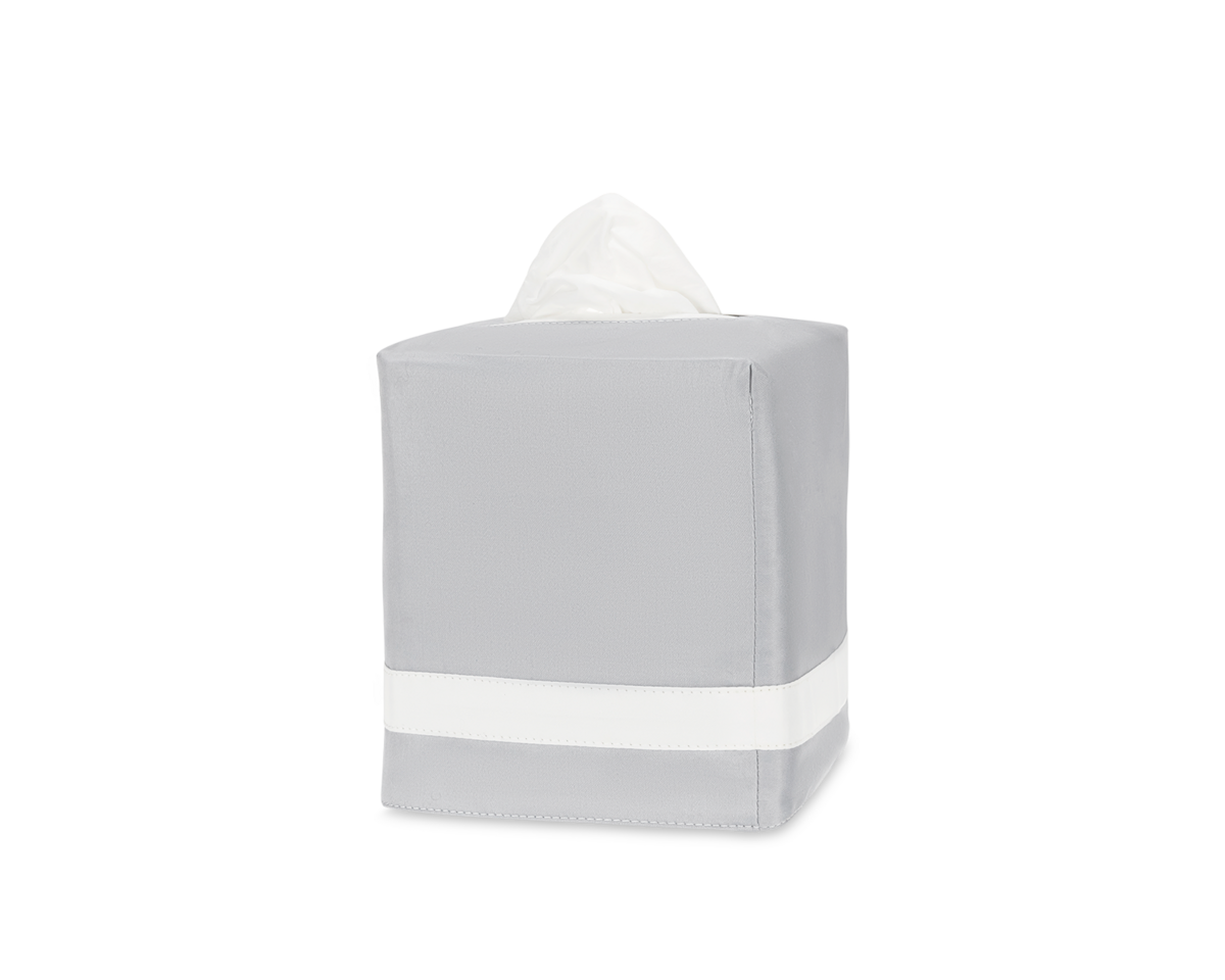 The Matouk Nocturne | Tissue Box Cover in grey features a white horizontal stripe and visible tissues at the top, displayed on a plain white background—an elegant accent for your home decor.