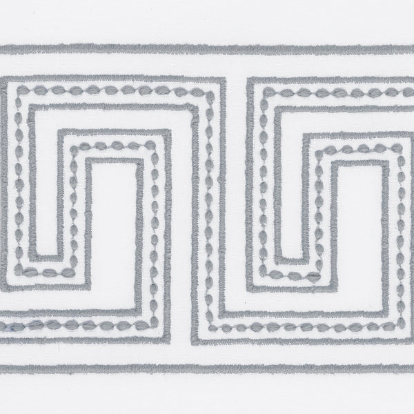 The Ophelia Embroidered Guest Towel Set by Matouk features a gray Greek key pattern with dotted accents on soft white fabric for a luxurious touch.