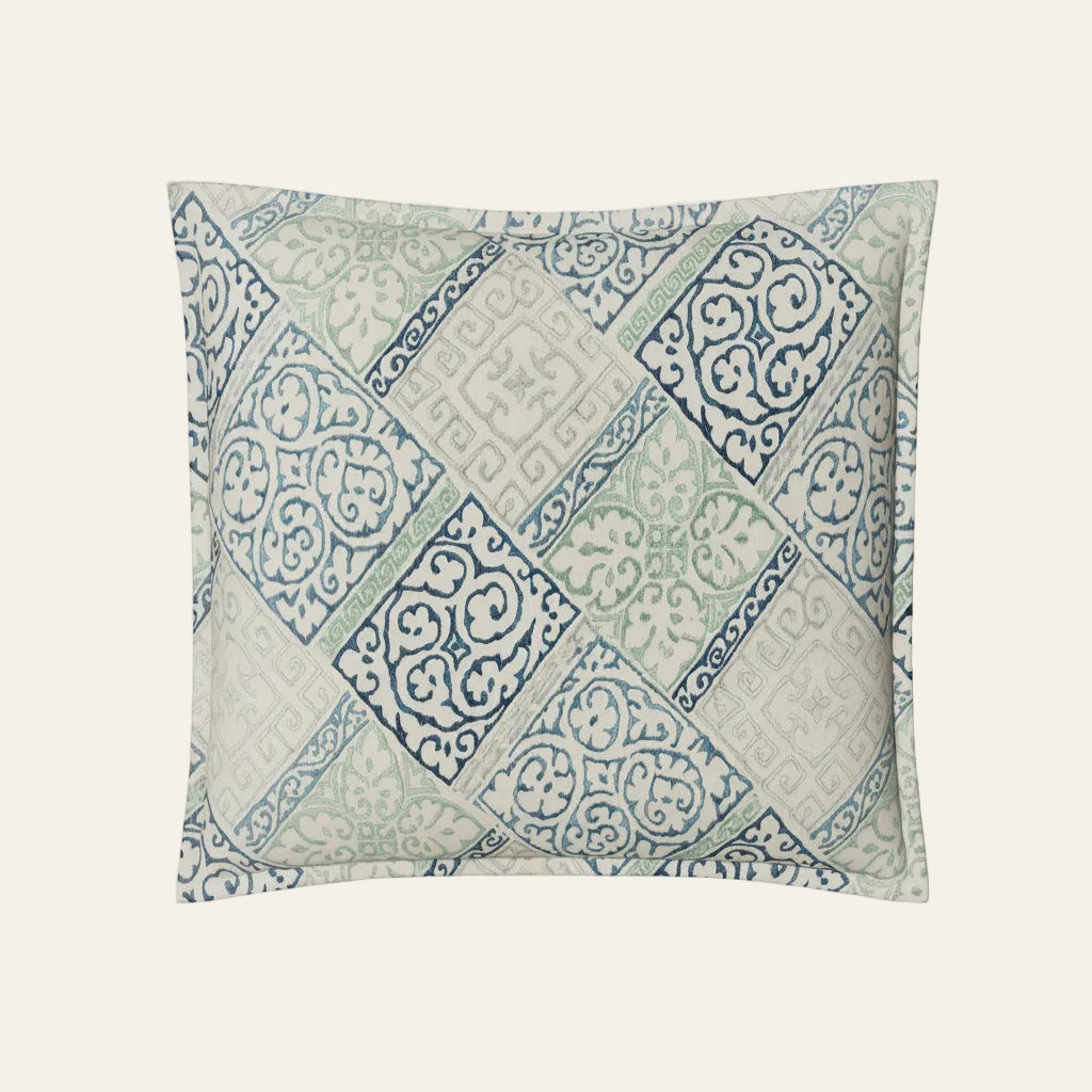 Ann Gish Oporto sham with diagonal tile pattern in blue, sage, and ivory.