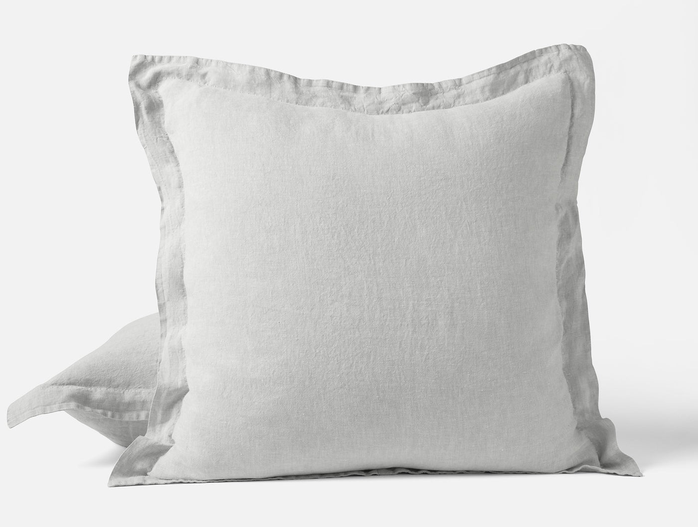 Reverse side of Coyuchi Relaxed Linen sham in white, showing flap closure detail.