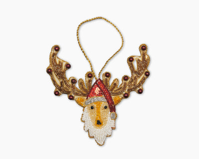 Henry Handwork beaded reindeer ornament with gold antlers and red santa hat.