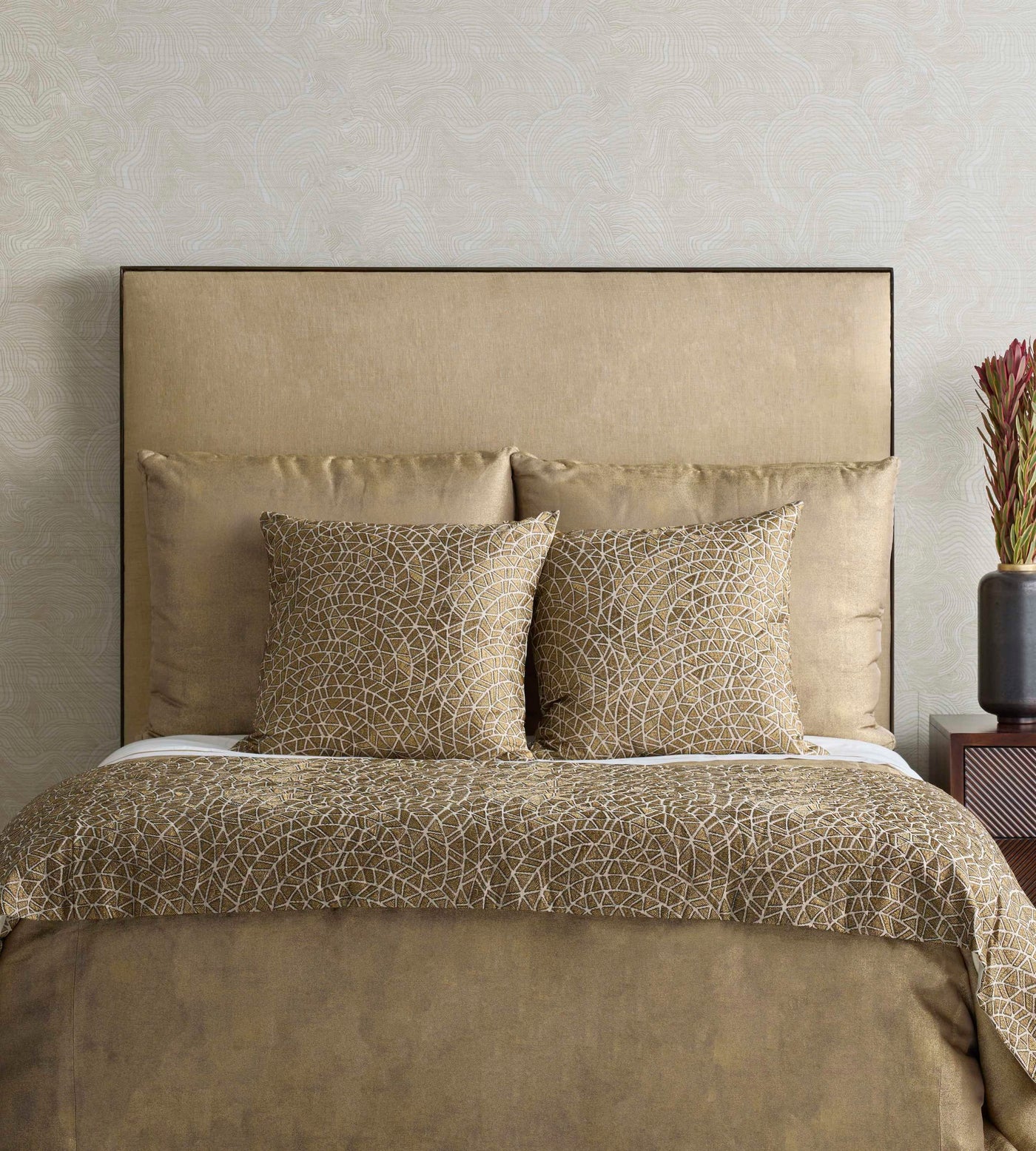 Close-up of Ann Gish Ornament duvet cover in bronze with intricate circular embroidered pattern.