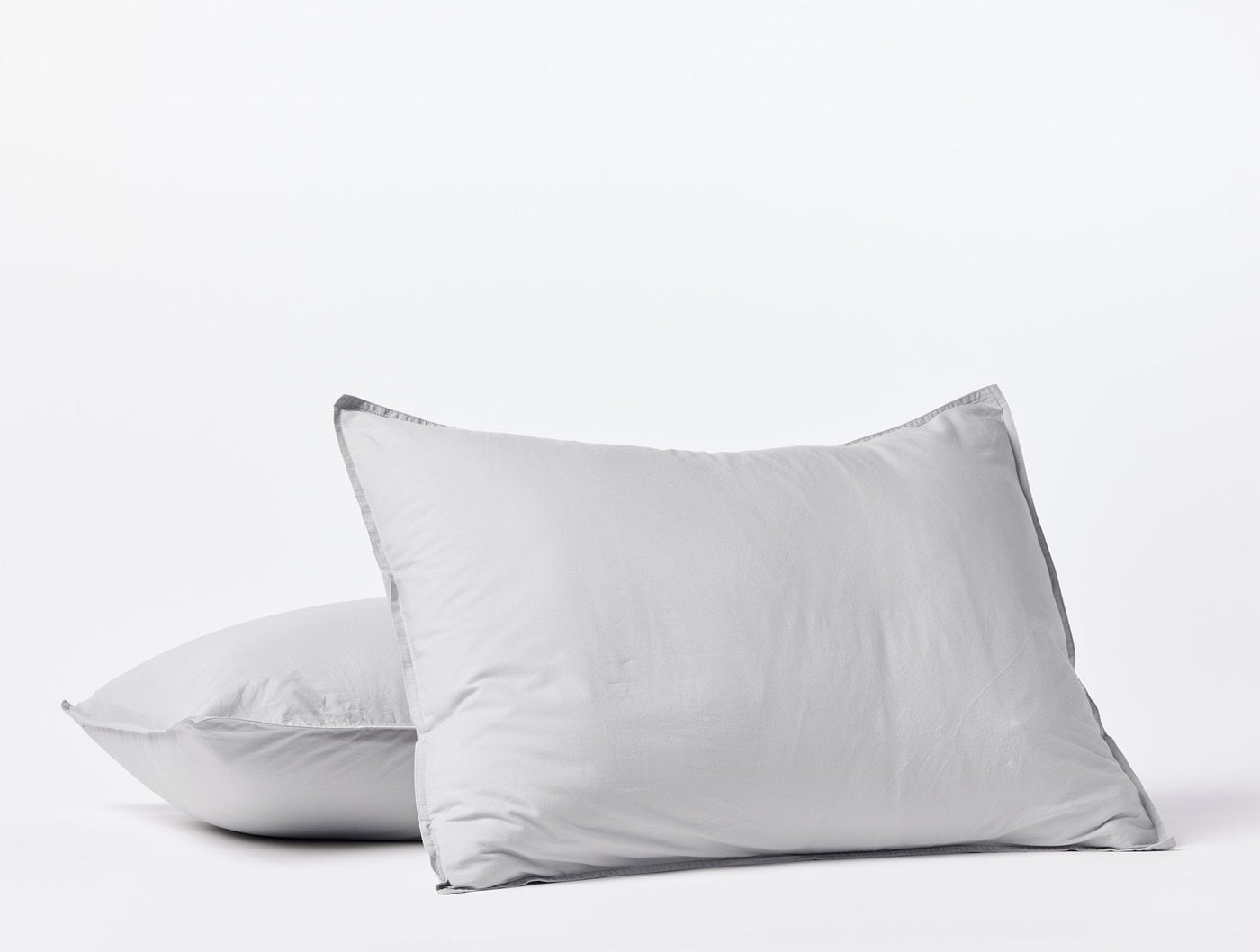 Two Coyuchi Crinkled Percale shams in silver-grey stacked against a white background.