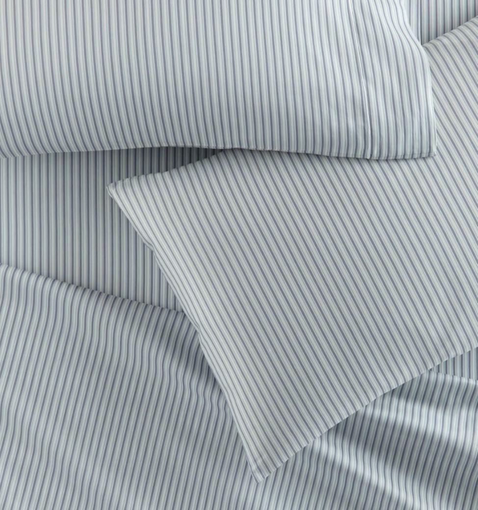 Gray and white striped fabric with a folded corner