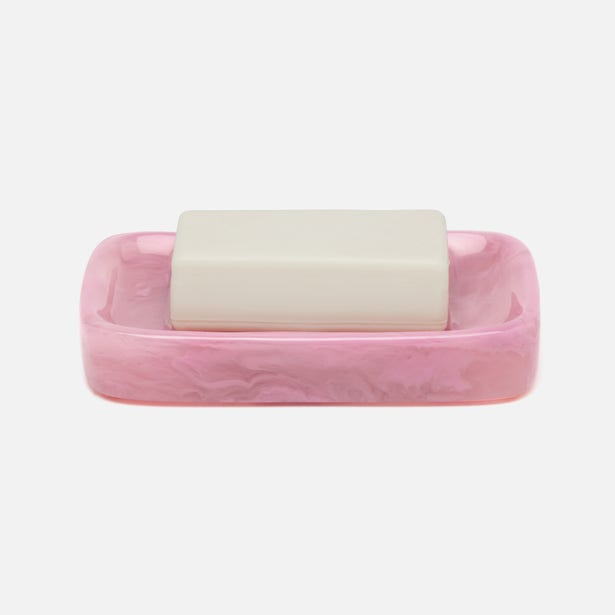 Pink marbled resin soap dish holding a white bar of soap, shown against neutral background.