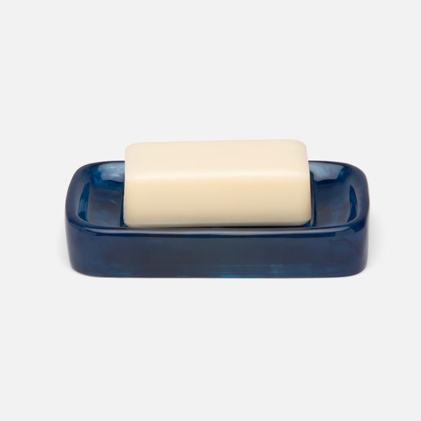 Pigeon & Poodle Abiko soap dish in navy blue glaze holding an ivory bar soap.