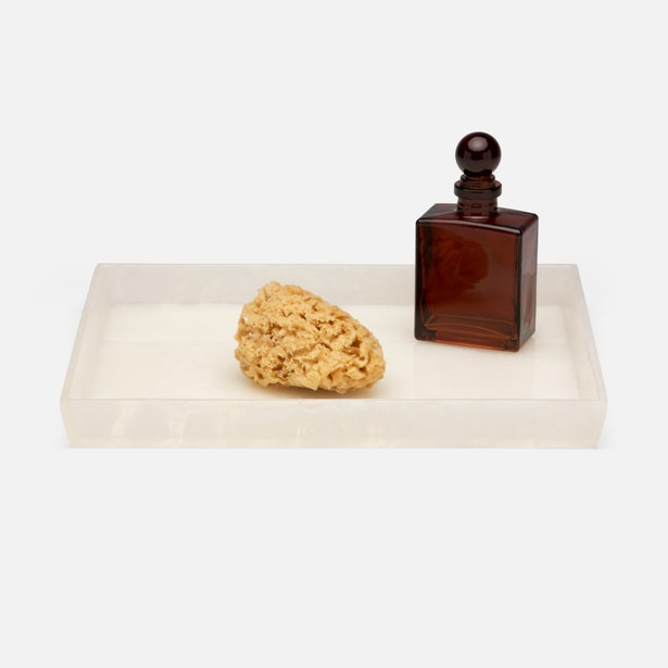 Pigeon & Poodle Abiko tray styled with a natural sponge and amber glass bottle.