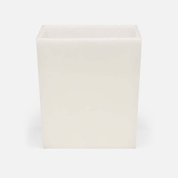 Pigeon & Poodle Abiko wastebasket in ivory resin, angled three-quarter view.