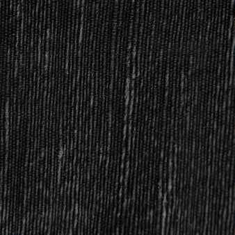 Close-up of Pigeon & Poodle Bruges soap pump surface in black with subtle ribbed texture.