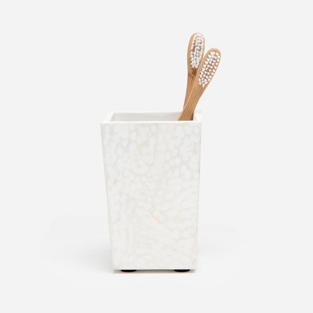 White mosaic-textured Pigeon & Poodle Callas brush holder with two bamboo toothbrushes.