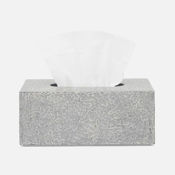 Callas tissue box in silver with hammered texture finish, tissue pulled through top.
