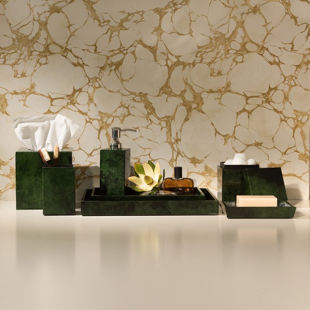 Dark green lacquered Carlow soap dish styled with matching bathroom accessories on marble surface.