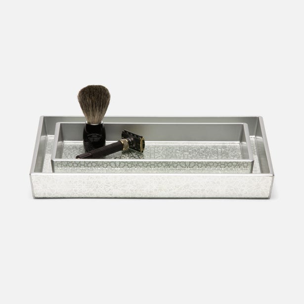 Pigeon & Poodle Caro bath tray in silver with embossed texture, styled with shaving accessories.
