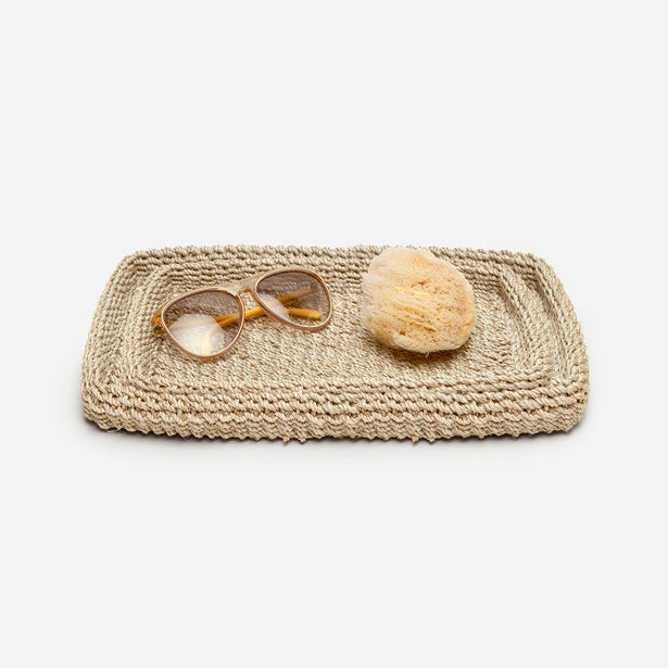 Pigeon & Poodle Chelston woven natural fiber tray styled with sunglasses and a sea sponge.