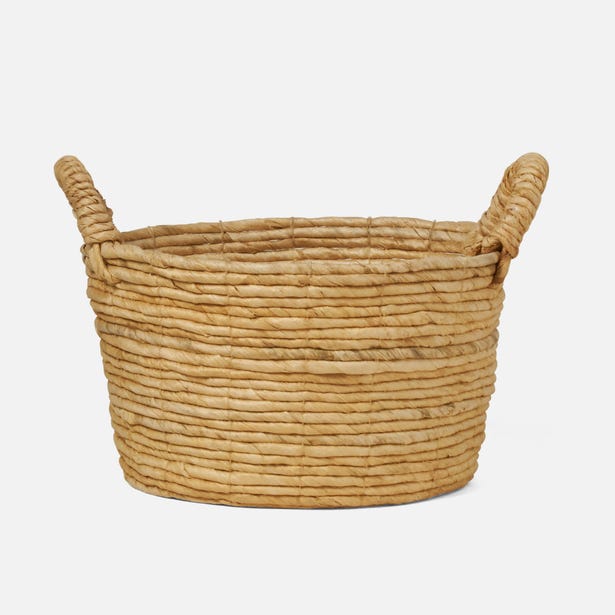 Pigeon & Poodle Clio basket, natural woven texture with looped handles, angled side view.