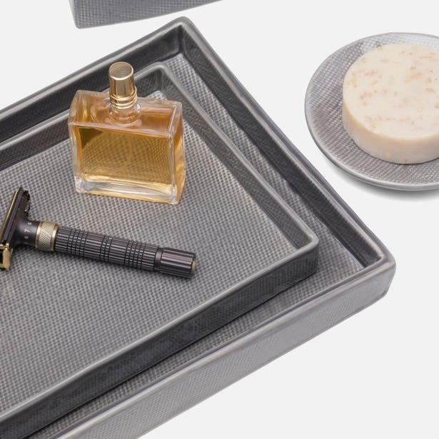 Pigeon & Poodle Cordoba grey textured tray styled with cologne bottle and razor.