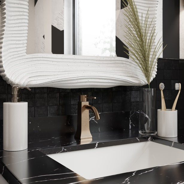 Cordoba bath canister holding toothbrushes on black marble vanity with soap dispenser.