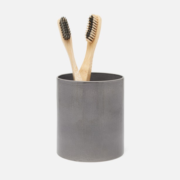 Pigeon & Poodle Cordoba brush holder in slate grey with textured finish, holding two bamboo toothbrushes.