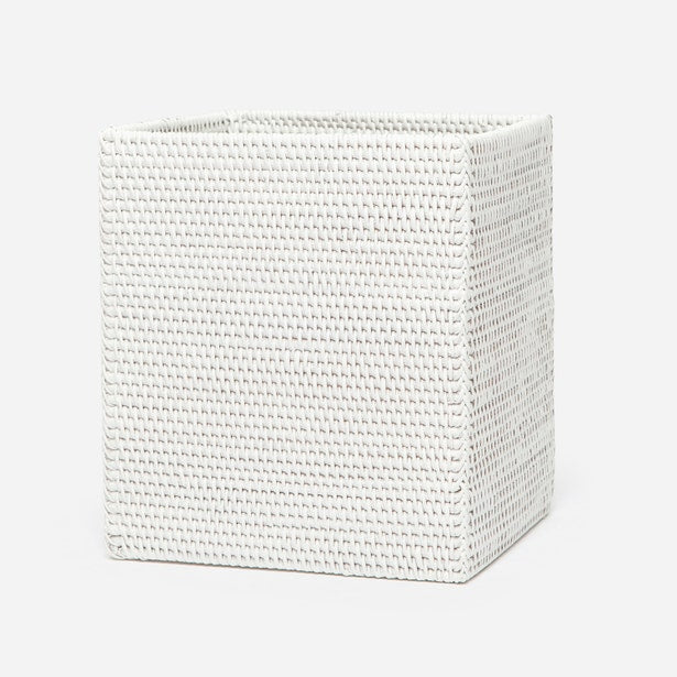 Pigeon & Poodle Dalton wastebasket in white woven rattan, three-quarter view.