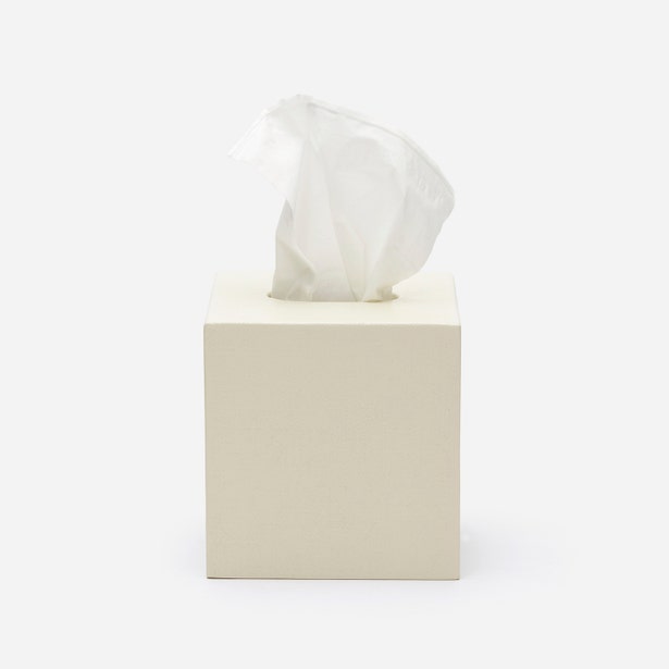 Pigeon & Poodle Dannes tissue box in ivory lacquer with tissue pulled through top slot.