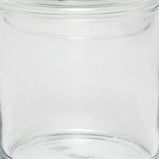 Close-up of Pigeon & Poodle Darby clear glass bath canister with fitted lid.