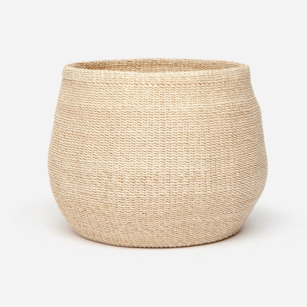 Pigeon & Poodle Davao basket in natural woven seagrass, rounded silhouette against white background.