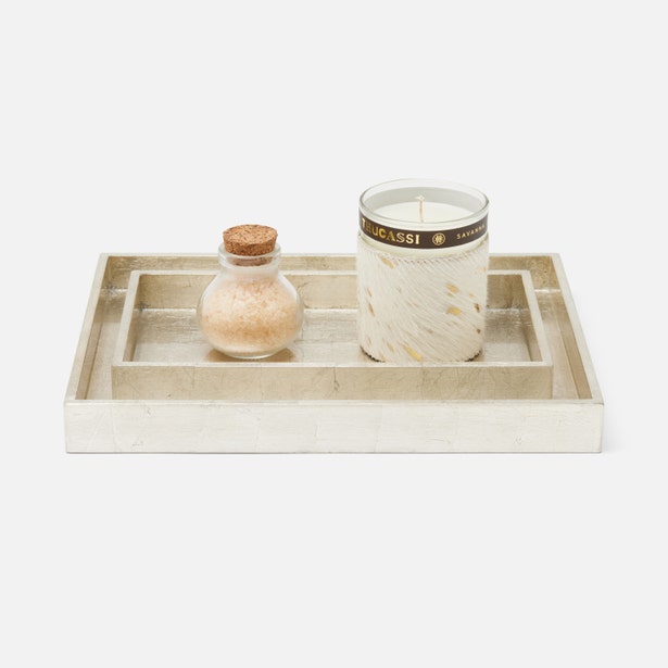 Pigeon & Poodle Davos nesting trays styled with a candle and bath salts, ivory bone inlay finish.