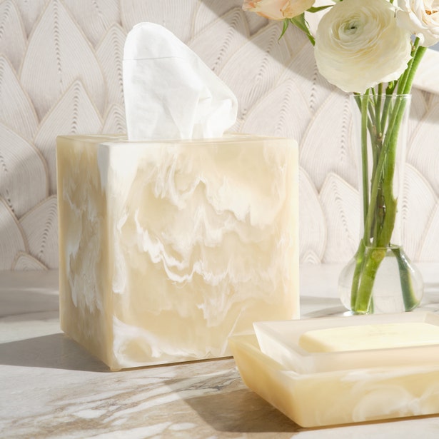 Ivory marbled resin tissue box cover alongside a Duluth nesting tray on a marble surface.