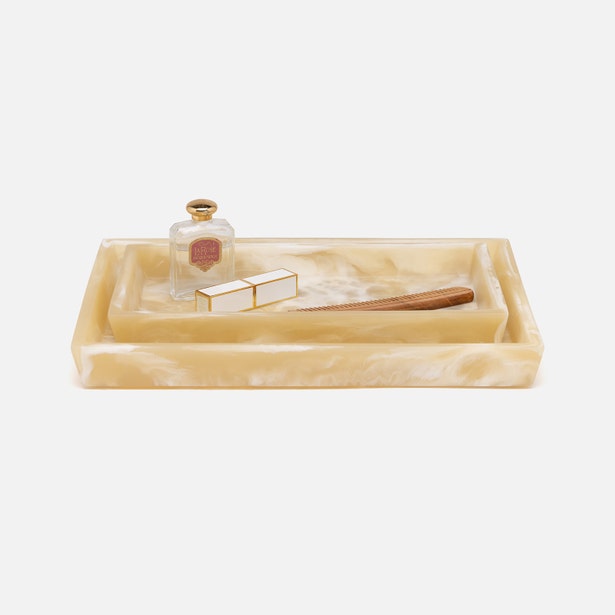Honey alabaster resin tray styled with perfume bottle, gold box, and comb.