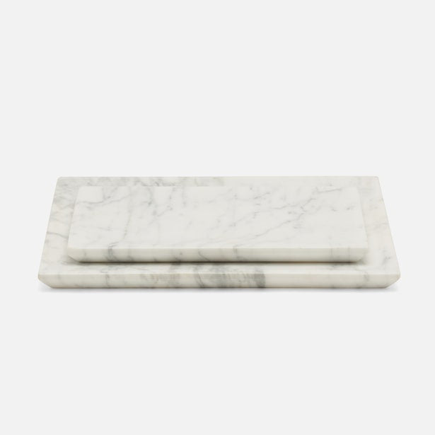 Two white marble Elyria nesting trays with grey veining, stacked and angled on grey background.