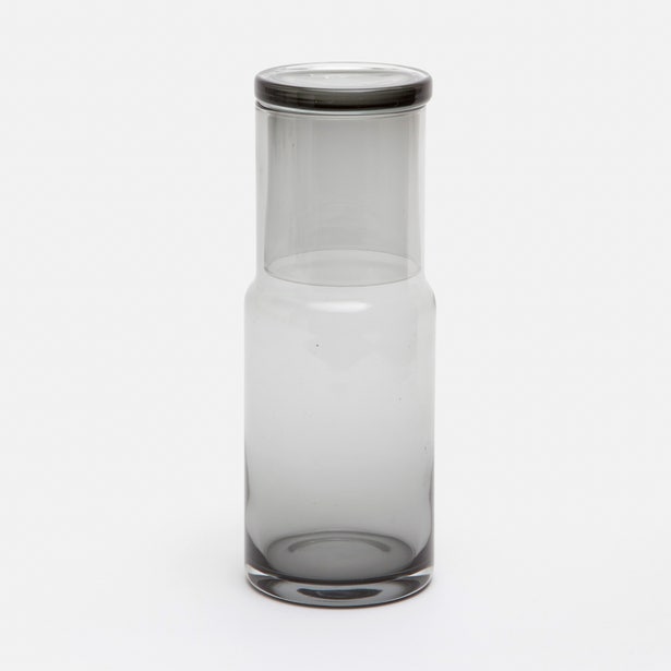 Smoke-tinted glass carafe with small tumbler lid, full-height front view on white background.