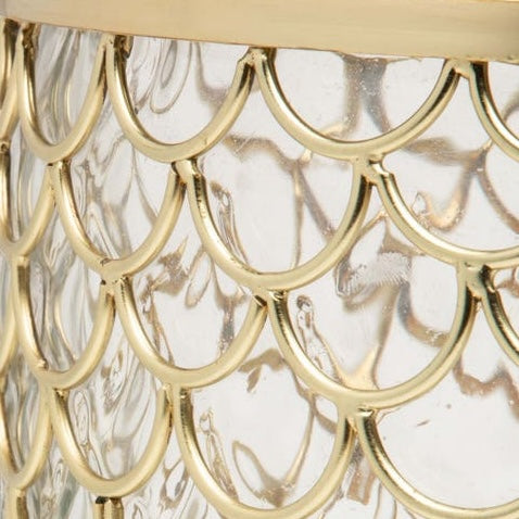 Close-up of Pigeon & Poodle Gila brush holder's gold scalloped metalwork over marbled glass.