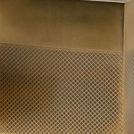 Close-up of Pigeon & Poodle Hagen brush holder base in brass with diamond lattice detail.