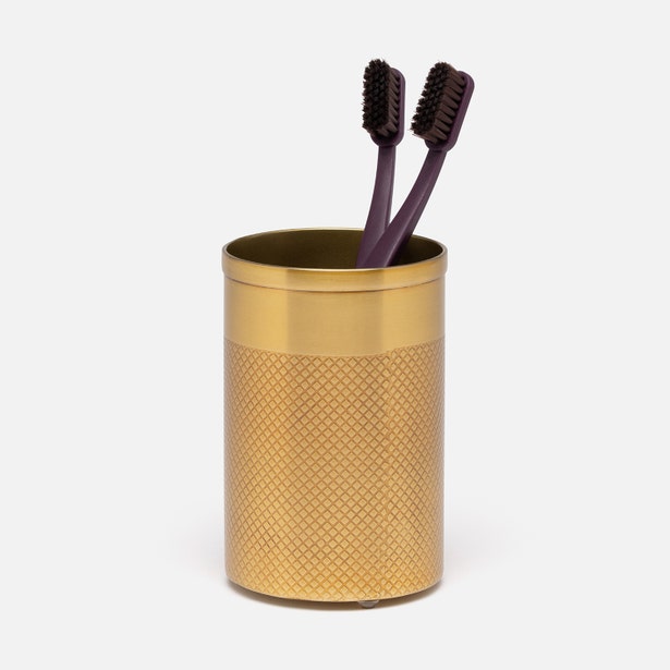 Pigeon & Poodle Hagen brush holder in brushed gold with diamond-knurl texture, holding two toothbrushes.