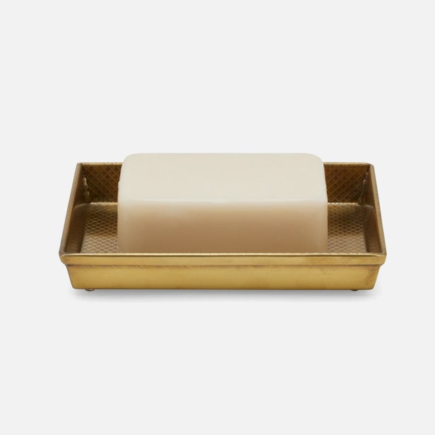 Pigeon & Poodle Hagen soap dish in brushed gold with textured base, holding a bar of soap.