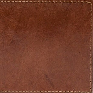 Close-up of cognac leather texture with contrasting saddle-stitch trim detail.
